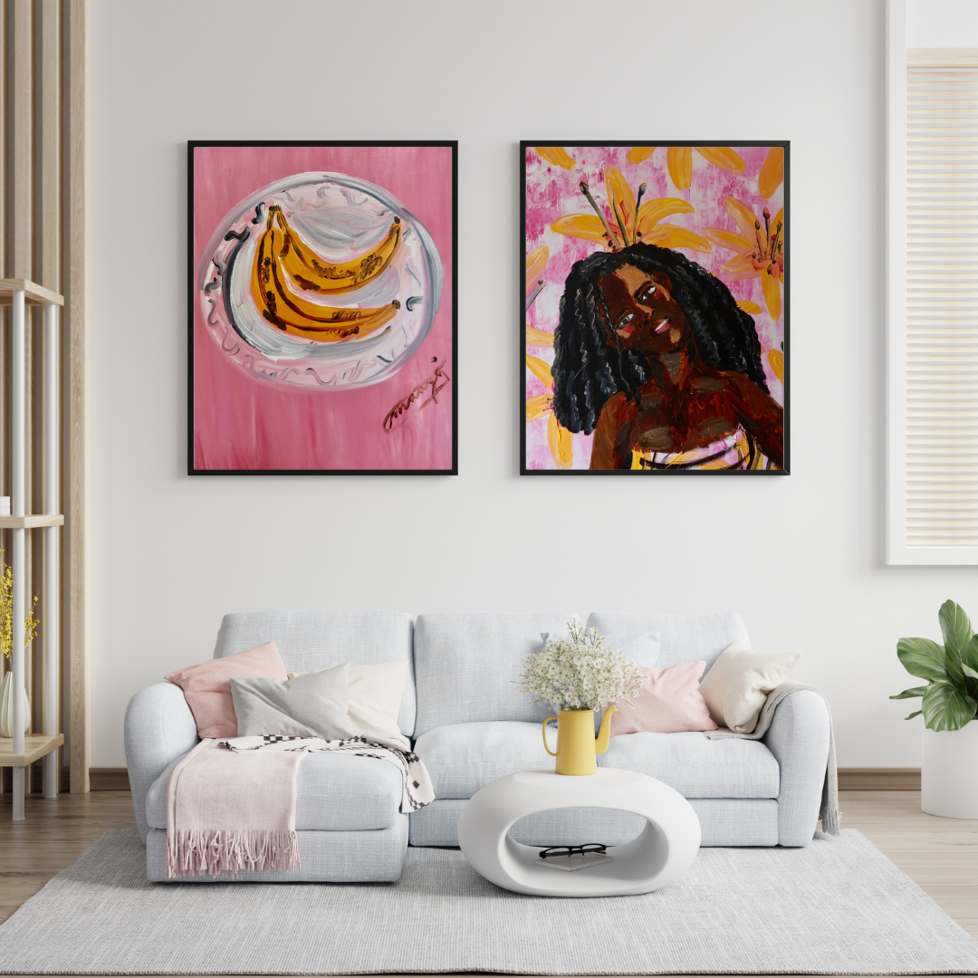 Two Michelle Amo paintings hung above a sofa in a living room